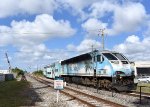 BL36PH # 825 pushes the Tri-Rail shuttle train away from Metrorail Transfer Station toward the yard just north of the depot